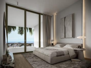 An interior photograph taken from a luxury apartment for sale at Pafilia Plaza with the balcony view highlighted in the background